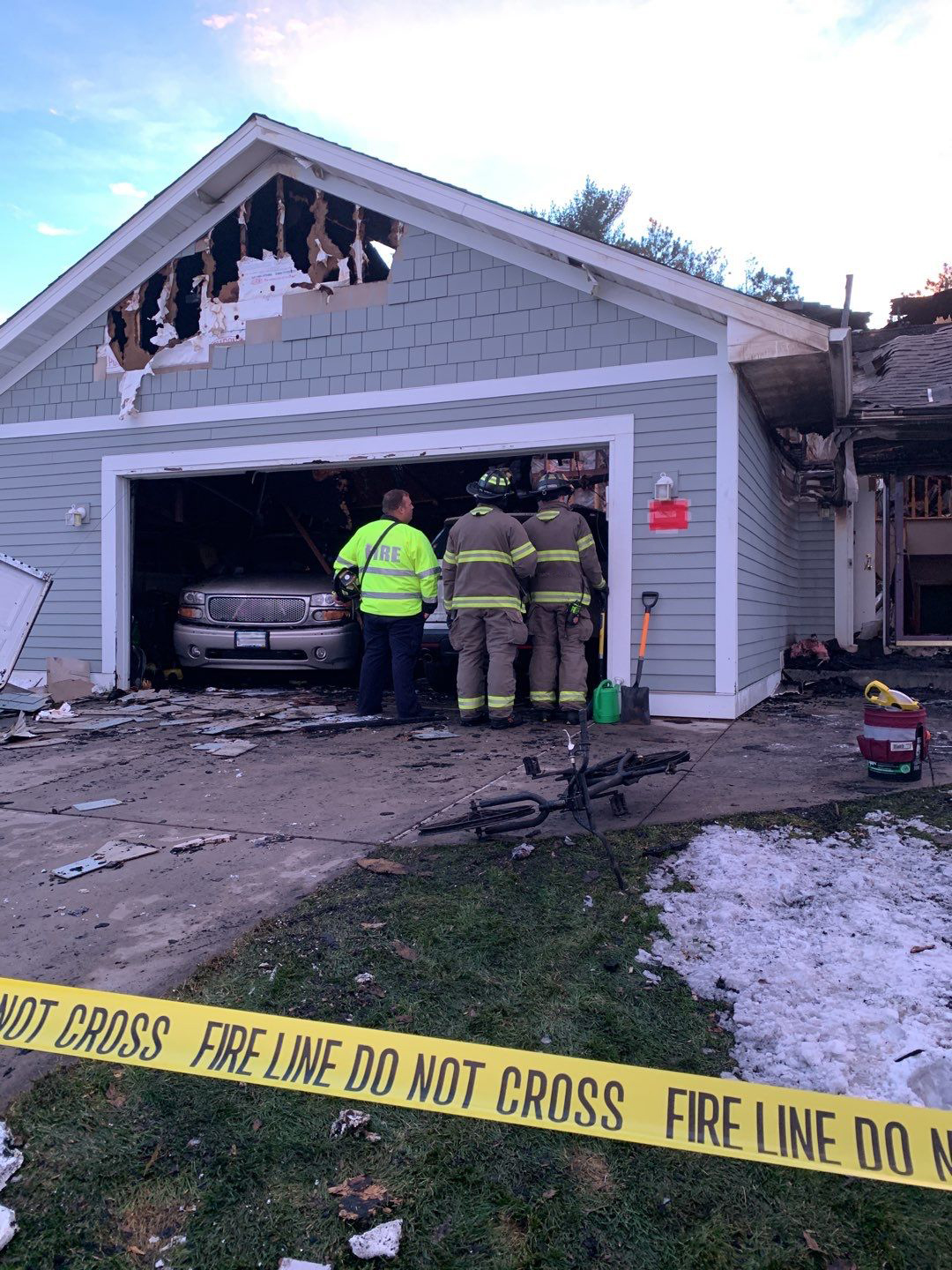 firefighters examining home